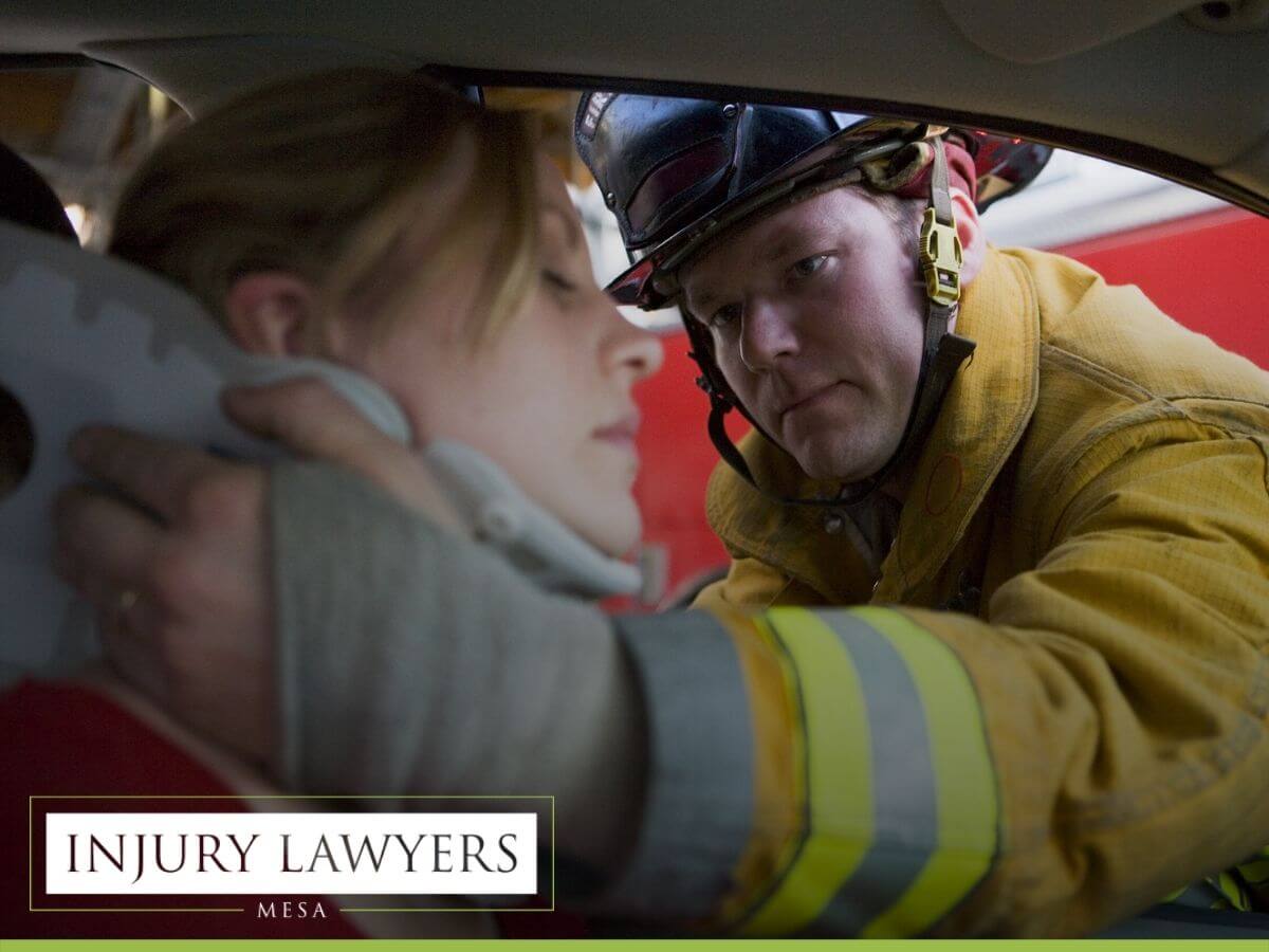 Fireman helping a woman in a car accident